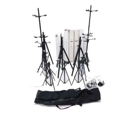 A quantity of speaker and guitar stands, mainly boxed. 