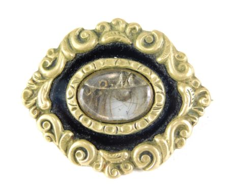 A Victorian memorial brooch, with brass outer border and central memorial panel, with black enamel and plain back, 3.5cm wide