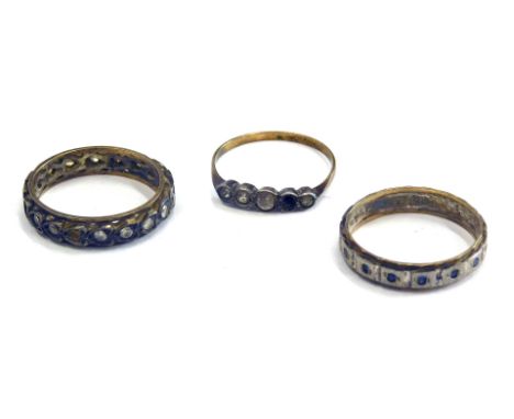 A group of dress rings, comprising a 9ct gold and silver paste stone set dress ring, 9ct gold and silver eternity ring, and a