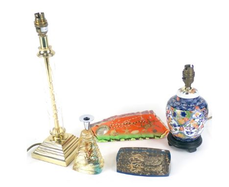 Two seascape collectors paperweights, a brass and glass table lamp, ceramic table lamp and a fish candle stand.