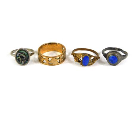 A group of dress rings, comprising a silver lapis lazuli set dress ring, gold plated wedding band, lapis lazuli plated dress 