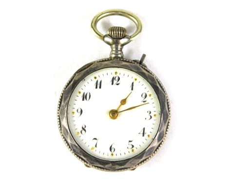 A Continental fob watch, with hammered outer casing, with vacant cartouche, white enamel dial, gold hands, bezel wind, white 