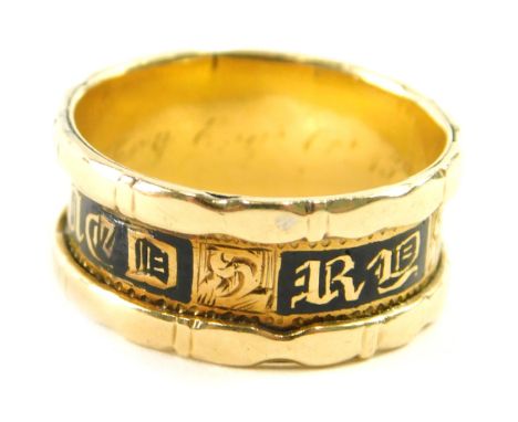 A Victorian black enamel decorated memorial ring, mark and memoriam message rubbed, size L, 4.1g. 