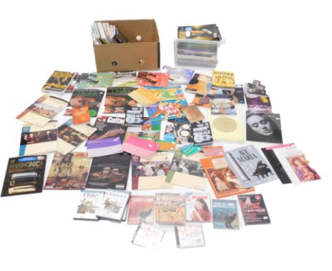 A quantity of music tuition books, sheet music, tuition DVDs for flute, clarinet, etc. 
