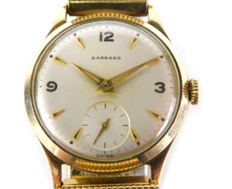 A Garrard 9ct gold cased gentleman's wristwatch, with silvered numeric dial, gold hands and seconds dial, inscribed presented