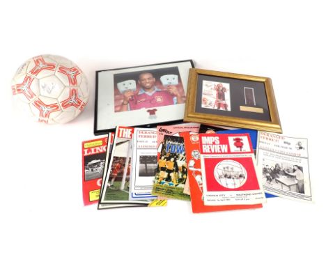 A collection of Lincoln City football memorabilia, to include a signed football, various programmes, a Burnley Football Team 