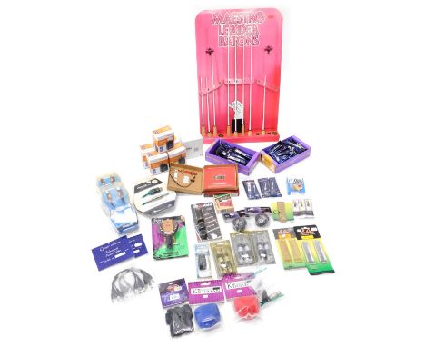 Eight Maestro leader batons, in a String Swing guitar keeper, and other accessories, clarinet and saxophone reeds, etc. 