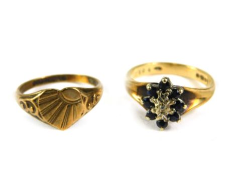 Two dress rings, comprising a 9ct gold sapphire cluster, and a 9ct gold signet ring, with central heart panel, 5.2g all in. (