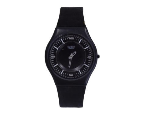 A Swatch watch, with black face and six dual movement, marked V8, with a numeric dial with silvered hands, on a suede bracele