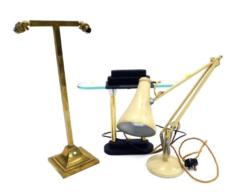 Three vintage lamps, comprising a cream Anglepoise desk lamp, 51cm high, a brass two branch table lamp, 59cm high, and a Robe