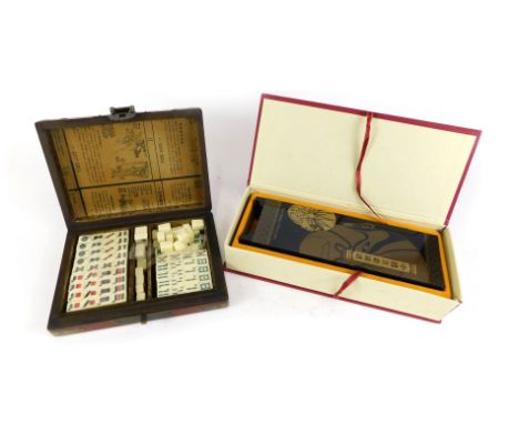 Oriental wares, comprising modern oriental mask panel screen, in presentation box and a red lacquer oriental cased Mahjong se