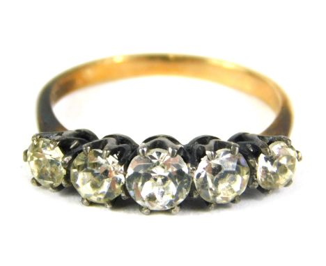 A 9ct gold and silver five stone dress ring, set with five paste stones, ring size K½, 2.9g all in. 