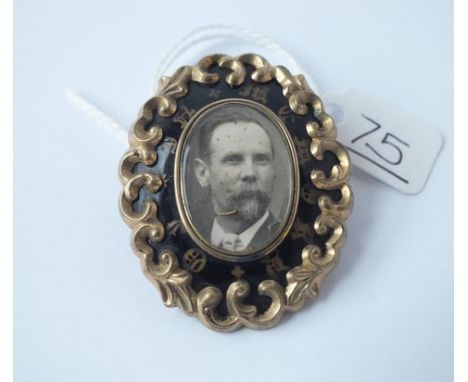 A Victorian mourning brooch with black enamel " in memory of"