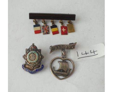 Three assorted brooches (1 x military army service corps, 1 x Danish Viking boat) etc.