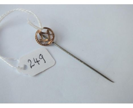 An antique masonic pierced stick pin in 9ct