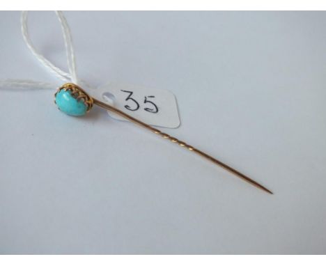 A turquoise drop stick pin in 15ct gold