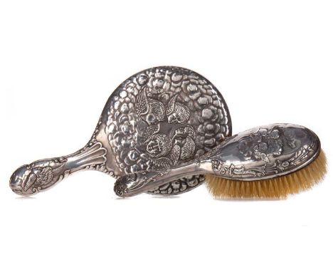 GEORGE V SILVER BACKED HAND-MIRROR,maker J. &amp; R. Griffen, Chester 1913, repousse decorated in the Reynold's Angels patter