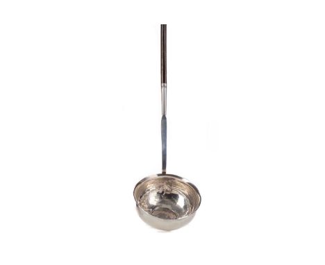 GEORGE III PUNCH LADLE,the unmarked silver bowl inset with Queen Anne coin, with spiral twist baleen handle, 37cm long