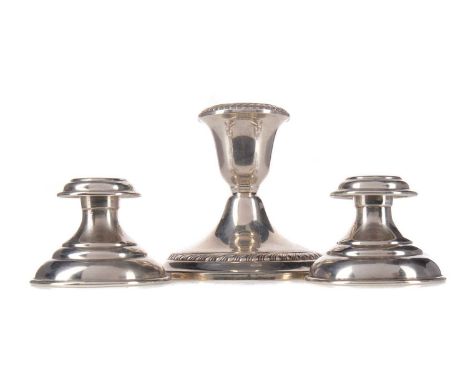 PAIR OF COLUMBIAN SILVER DWARF CANDLESTICKS,of stepped circular form, 4.8cm high, bases loaded, along with an American Gorham