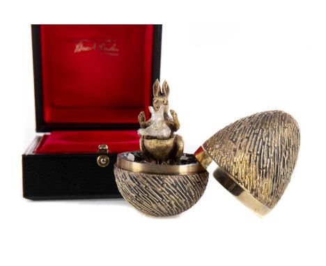 SILVER GILT 'SURPRISE' EGG BY STUART DEVLIN,London 1974, enclosing a kangaroo and joey, with associated pierced coronet stand