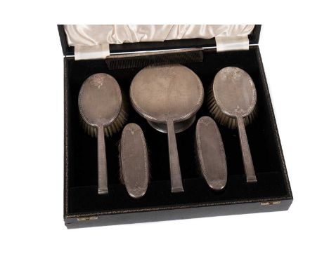 ELIZABETH II SILVER BACKED DRESSING TABLE SET,maker W.I. Broadway &amp; Co., Birmingham circa 1979/80, comprising two hairbru