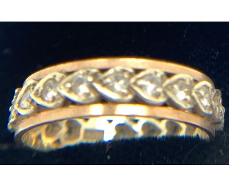 A 9ct gold eternity ring set with clear stones, size P. Weight 2.8gm.