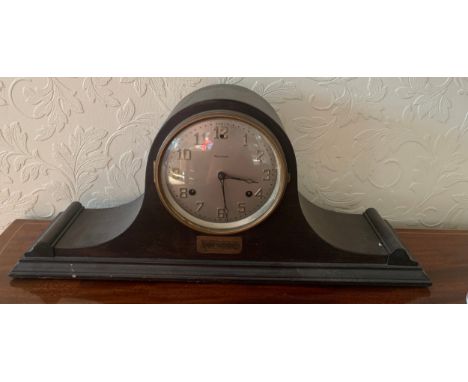 An American mantle clock by Waterbury, Napoleon hat shape. 26 h x 57cm w.