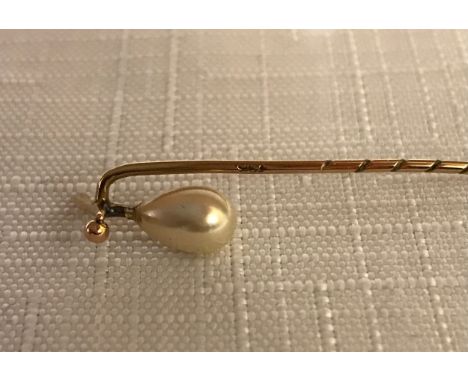 A cased 9ct gold and pearl tie pin. 6cm l.Condition ReportGood condition.