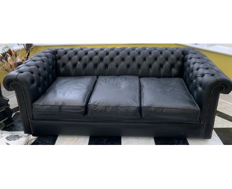 A pair of black leather button backed Chesterfield sofas. 190 l x 65 h x 87 d.Condition ReportLeather dry and marked in place