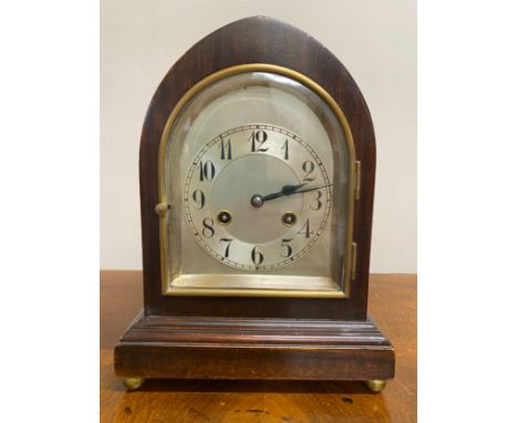 A 20th century mahogany mantle clock, with silvered dial and Arabic numerals movement marked Unghans J, Wurttemberg A42, heig