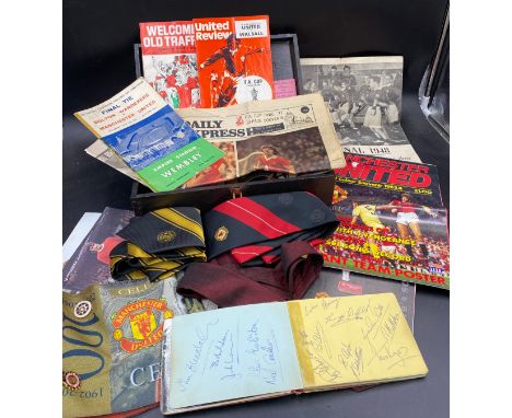 A quantity of Manchester United memorabilia to include ties, scarf, newspapers, matchday programmes and an autograph book con