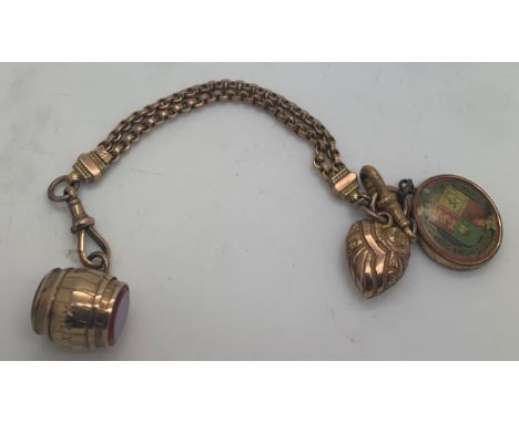 A 9ct gold chain with 3 x 9ct gold charms. Total weight 14.4gm.