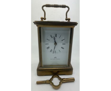 A brass carriage clock by Matthew Norman. 14cm h. In working order.Condition ReportIn working order.