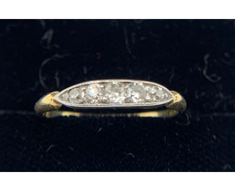 A five stone diamond ring set in 18ct gold. Weight 1.7gm. Size M.Condition ReportGood condition.