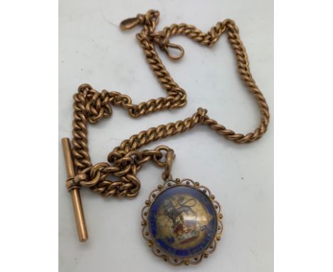 A 9ct gold chain, t bar and shilling fob set in a 9ct gold mount. Total weight 71.4gm.&nbsp; Weight of chain only 60.9gm and 