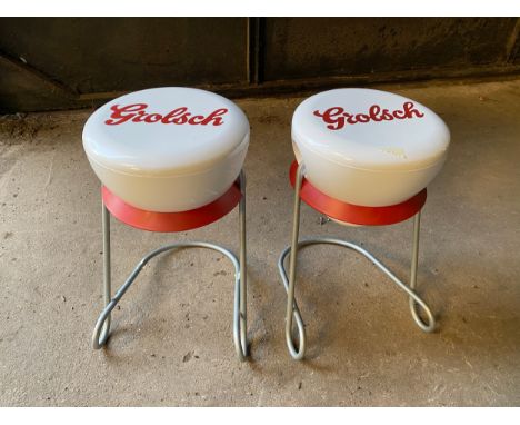 A pair of vintage Grolsch bracket side tables with plastic tops and aluminium legs. Approx. 26.5 w x 42cm h.Condition ReportG