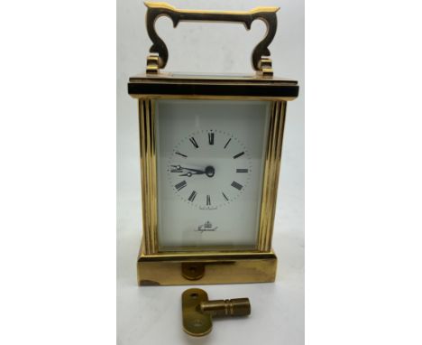 An 'Imperial' brass carriage clock with key. Winds and goes. 15cm h with handle up.Condition ReportGood condition.