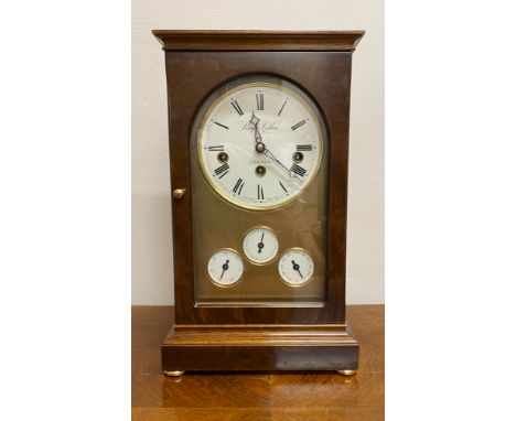 A walnut cased mantle clock calendar by Knight &amp; Gibbons, London on bun feet. 36cm high. Chimes and ticks. No key.Conditi