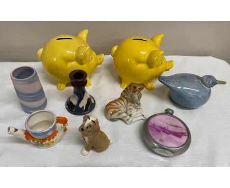 A selection of ceramics to include a Universal Made in England dog, a Terrybaun pottery candlestick, a zebra Made in USSR, 2 