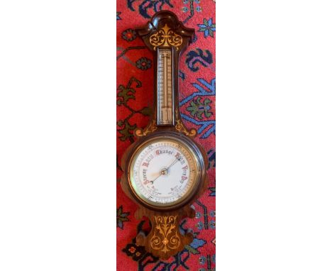 A good quality inlaid rosewood aneroid barometer. 81cm h.Condition ReportGood condition.