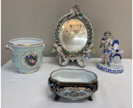 Various Continental ceramics to include mirror with putti, cherub with bow, dish and a Portuguese planter.Condition ReportSom