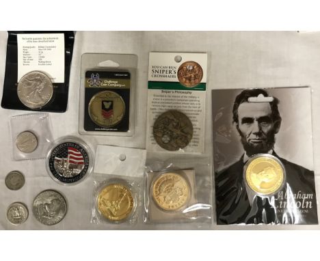 A selection of American coins to include 1991 Liberty one dollar coin in plastic cover and with certificate, 1974 Liberty one