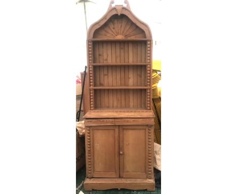 Pine dresser with 2 door base 3 height and  arch top shelf. 86 w x base height 91 x 47cm d. Overall height 230cm.Condition Re