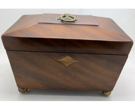 A 19thC  mahogany tea caddy on brass ball feet and brass flower basket ring to top. 20 x 11cm.Condition ReportReplacement ven