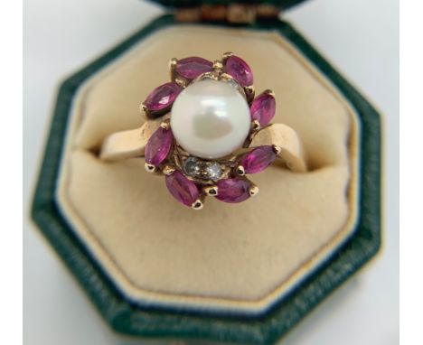 Ring marked .375 set with pearl, pink &amp; white stones. Size L/M, weight 2.3gms.Condition ReportGood condition.