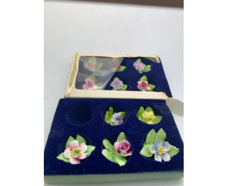 Royal Adderley floral bone china place name holders (11) in original boxes.Condition ReportBoxes at fault, tiny chip to one.