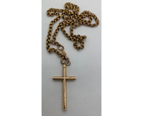 A yellow metal chain. Tests as 15ct with a 9ct gold crucifix. Total weight 11.6gm, chain length 46cm.Condition ReportGood con