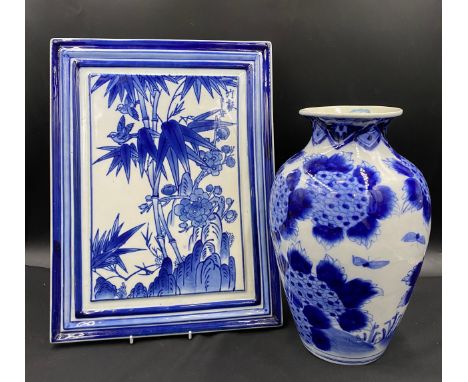 A 19thC Chinese blue and white vase together with a Chinese blue and white ceramic plaque.Condition ReportVase with repair to