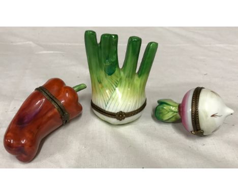 Three Limoges vegetable ceramic trinket boxes in the form of radish, red pepper and fennel.Condition ReportGood condition.
