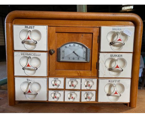 A vintage Dutch wooden spice cabinet with ceramic cream/red drawers a/f. 59 w x 14.5 d x 42cm h.Condition ReportCracks to cer